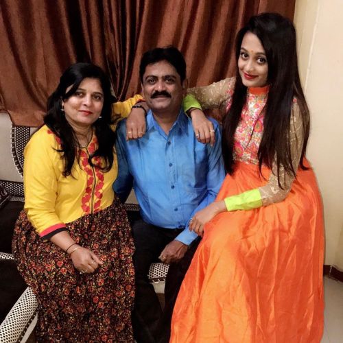 Meha Patel with her parents
