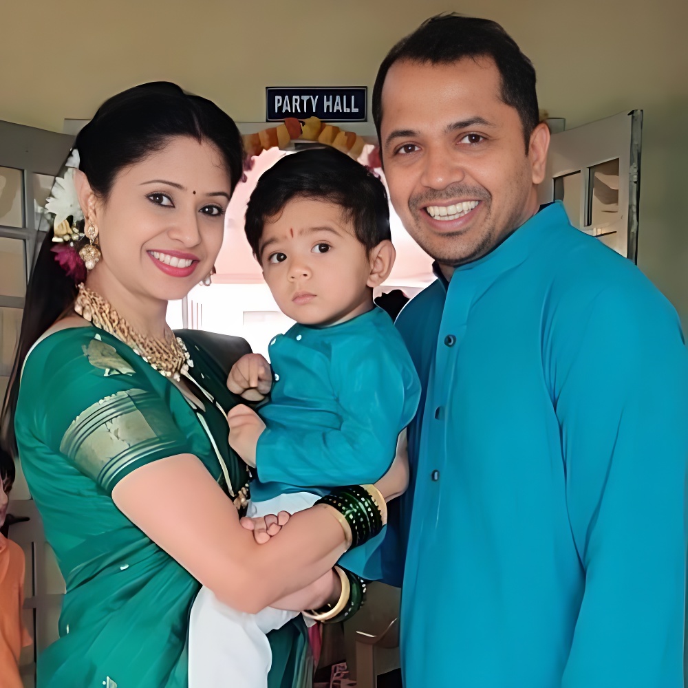 Akshata Ganesh with her son and husband